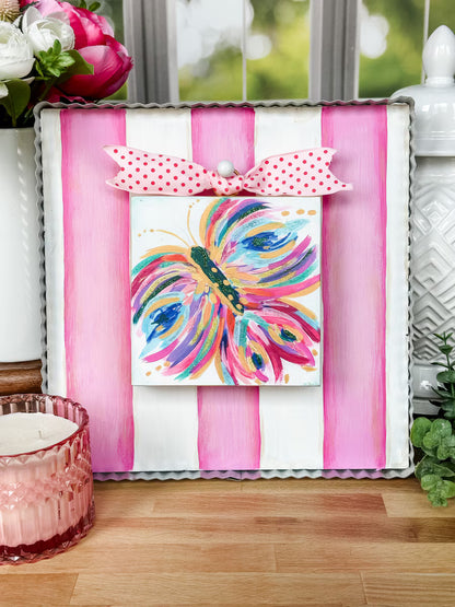 Pink and white striped display board
